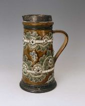 George Tinworth for Doulton Lambeth, a stoneware seaweed jug, 1879, conical flagon form, sgraffito