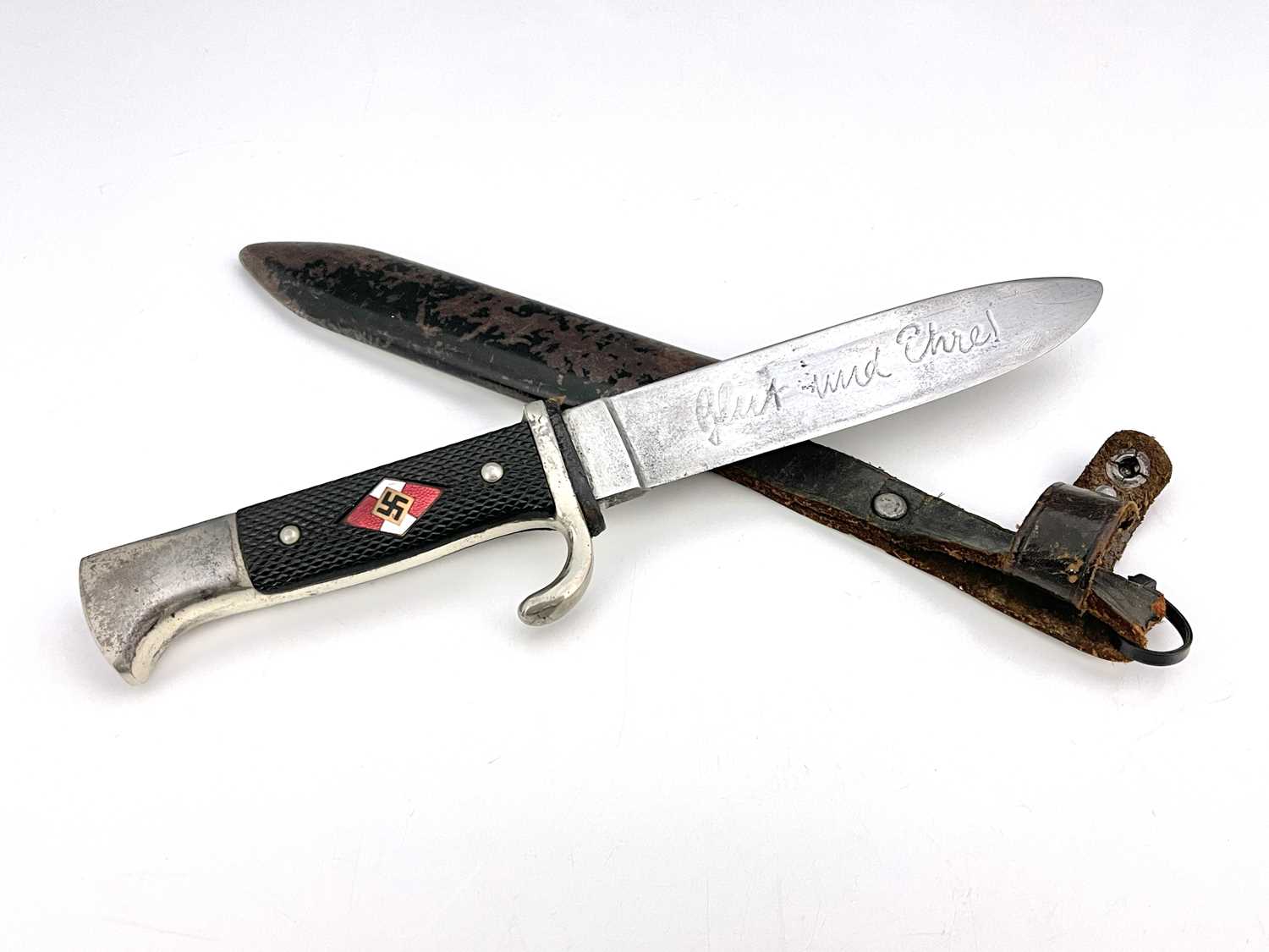 A German Third Reich Hitler Youth knife, nickel pommel and crossguard, diced grip with inset