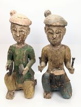 A pair of Chinese style carved wooden drummers, H.42cm