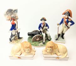 A collection of French Napoleonic porcelain soldiers and lions, various makers