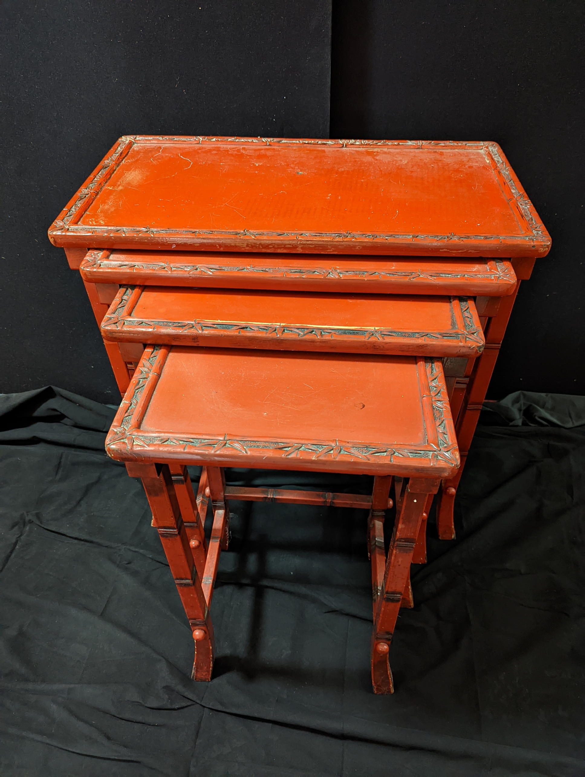 A nest of Chinese red lacquer tables