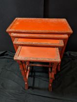 A nest of Chinese red lacquer tables