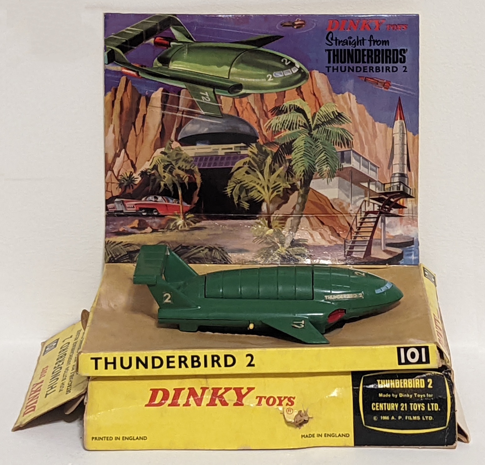 Dinky Toys No.101 Thunderbird 2, comprising of green body with four yellow plastic legs and red rear
