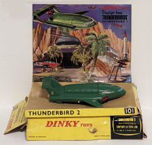 Dinky Toys No.101 Thunderbird 2, comprising of green body with four yellow plastic legs and red rear