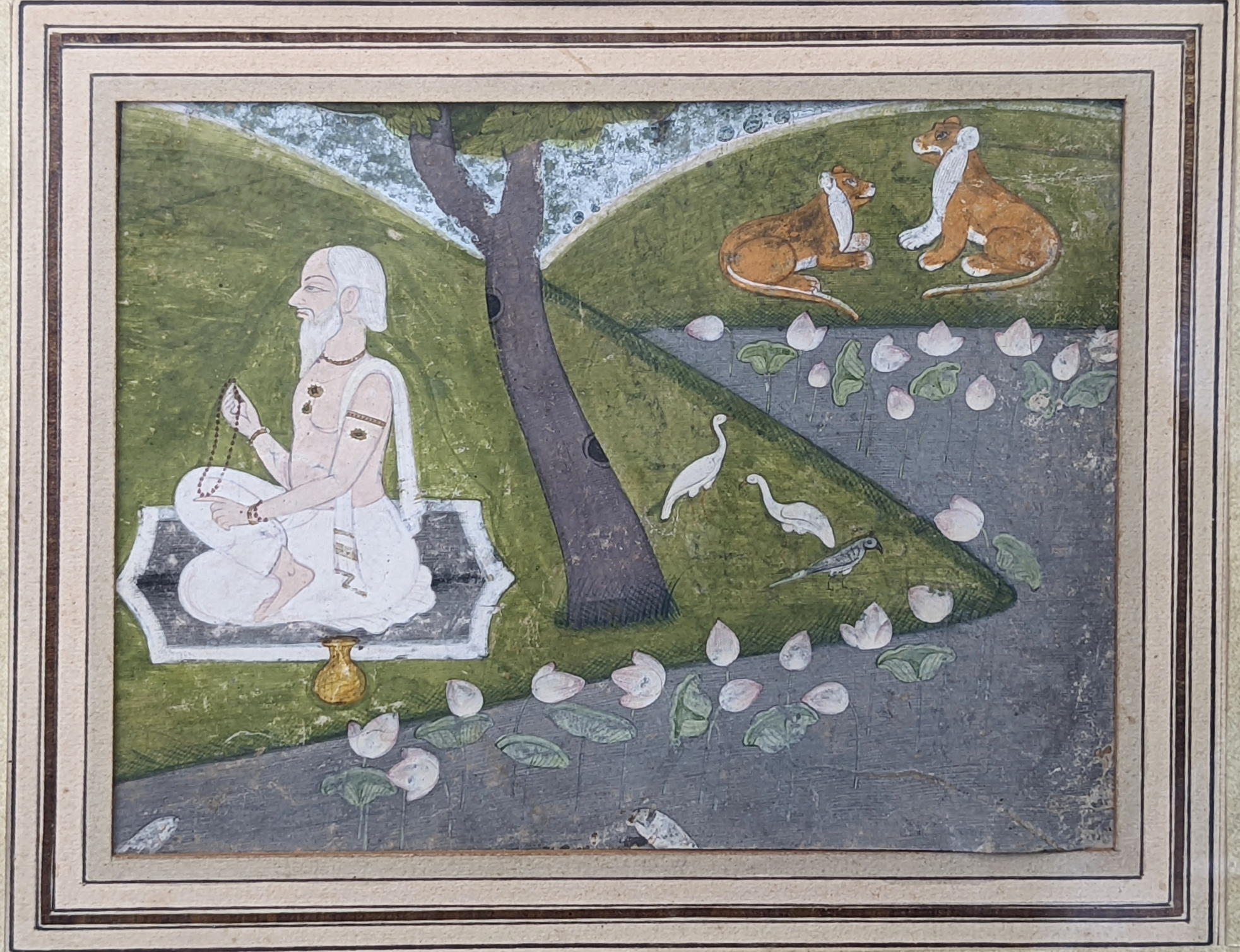 An 18th century provincial Mughal Indian miniature painting of a meditating sadhu, 12cm x 15cm