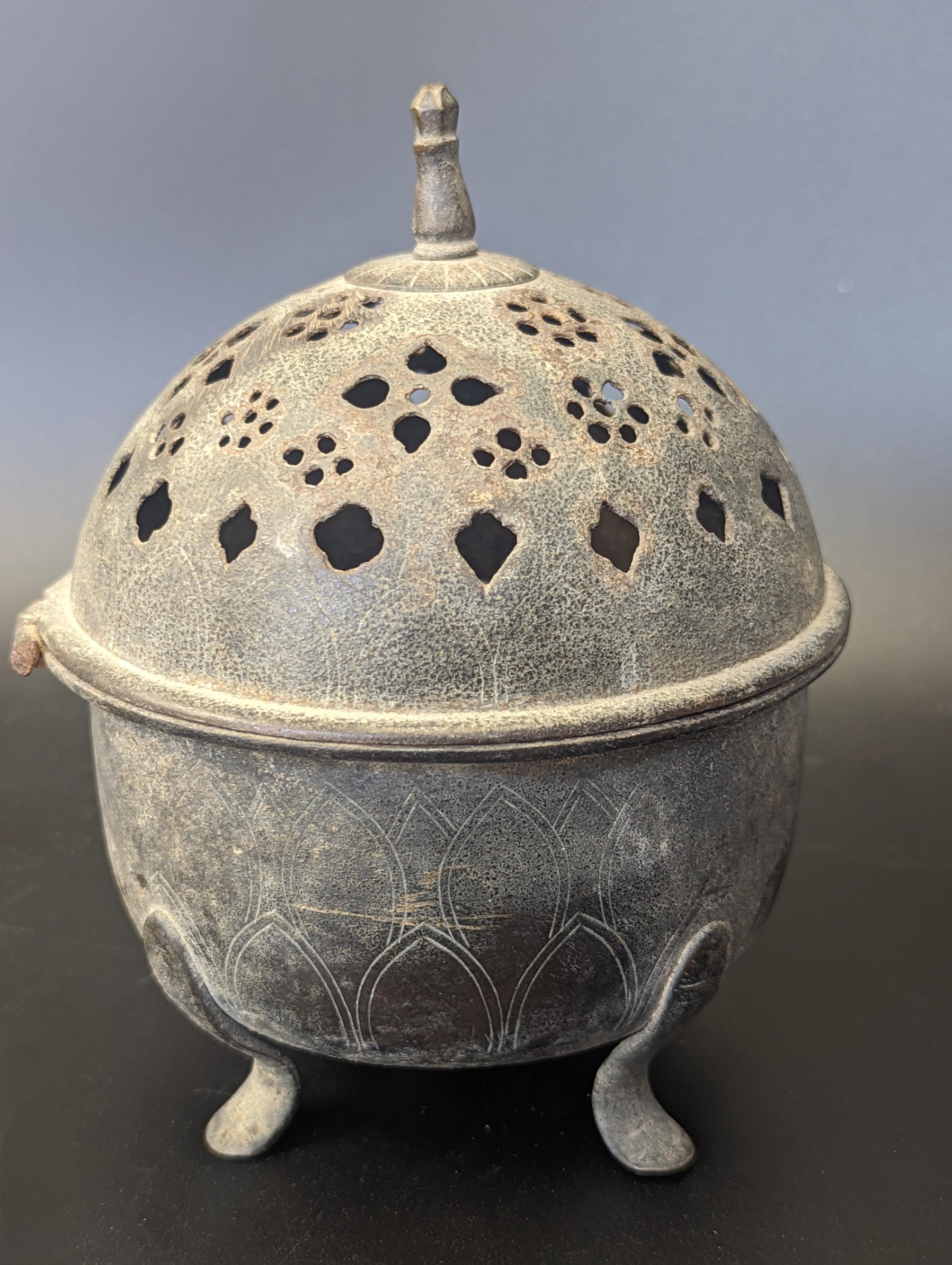 An early Islamic possibly Seljuk bronze incense burner, H.13cm
