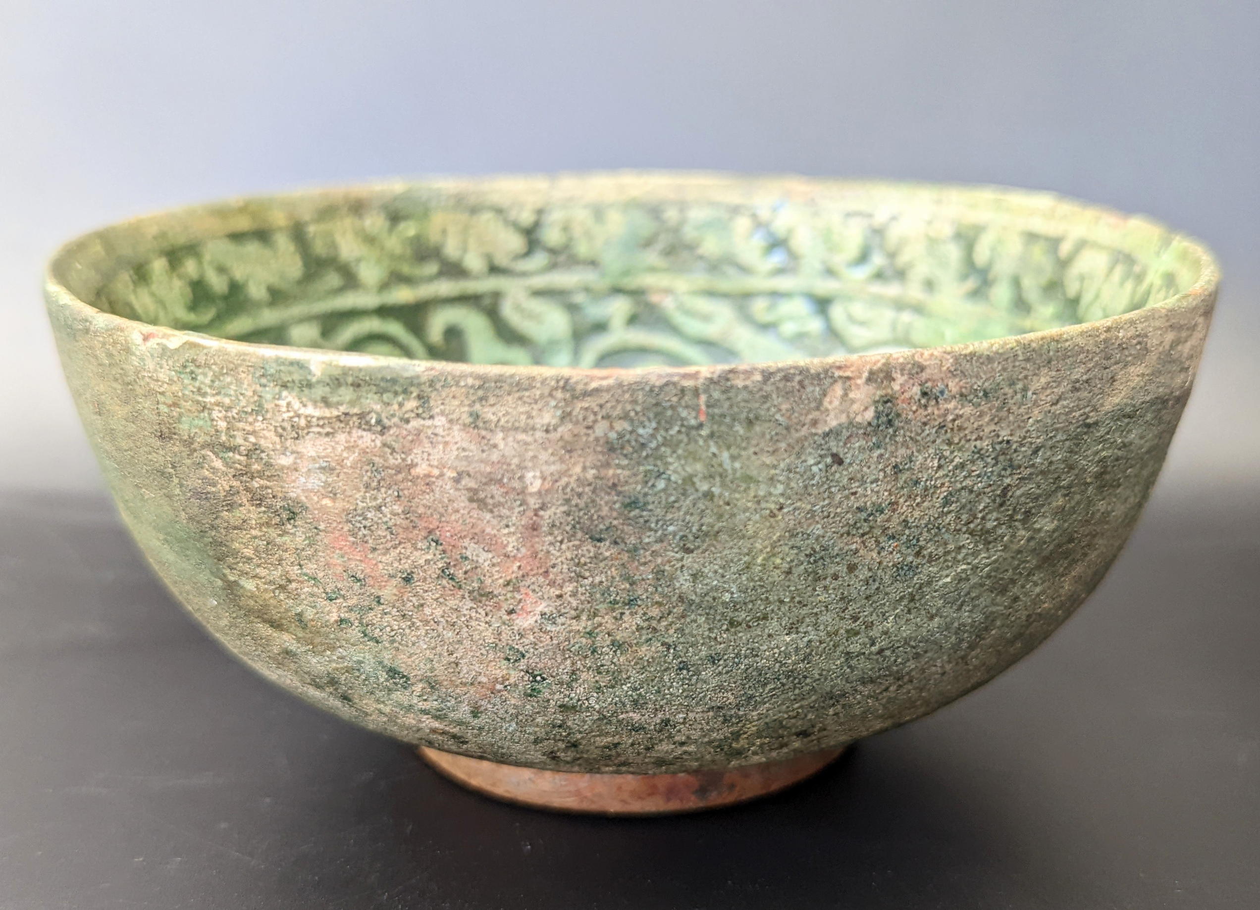 A rare 12th century Persian Garus ware green glazed pottery bowl depicting a mythical creature, H. - Image 5 of 5