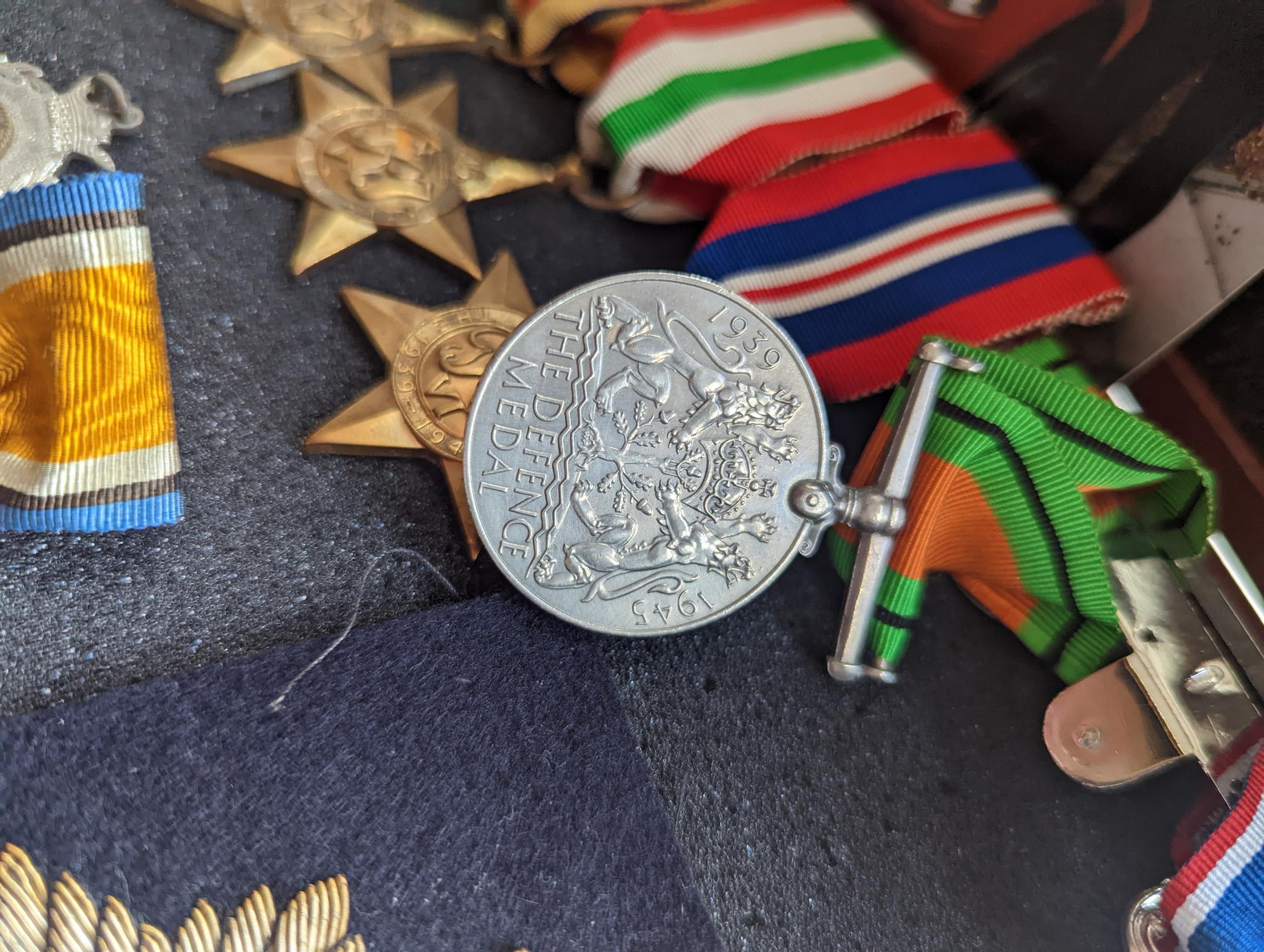 A collection of WWII military and other medals, coins to include a silver Moroccan dirham and casino - Image 3 of 4