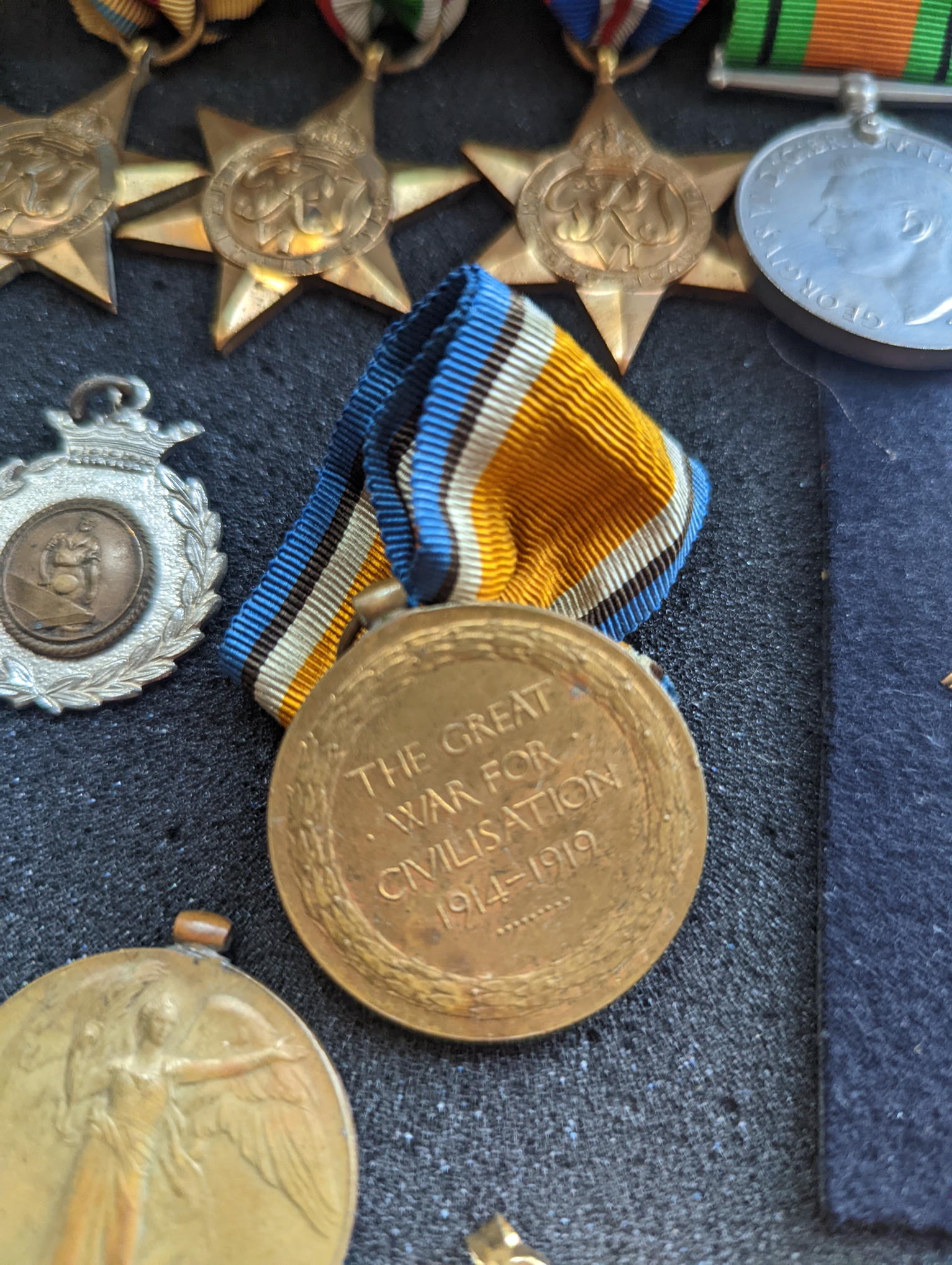 A collection of WWII military and other medals, coins to include a silver Moroccan dirham and casino - Image 2 of 4