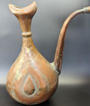 A 17th century Persian Safavid engraved copper Ewer, H.30cm