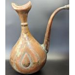 A 17th century Persian Safavid engraved copper Ewer, H.30cm