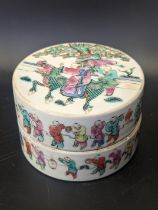 A Chinese 19th century famille rose circular pot and cover, decorated with 100 boys and two