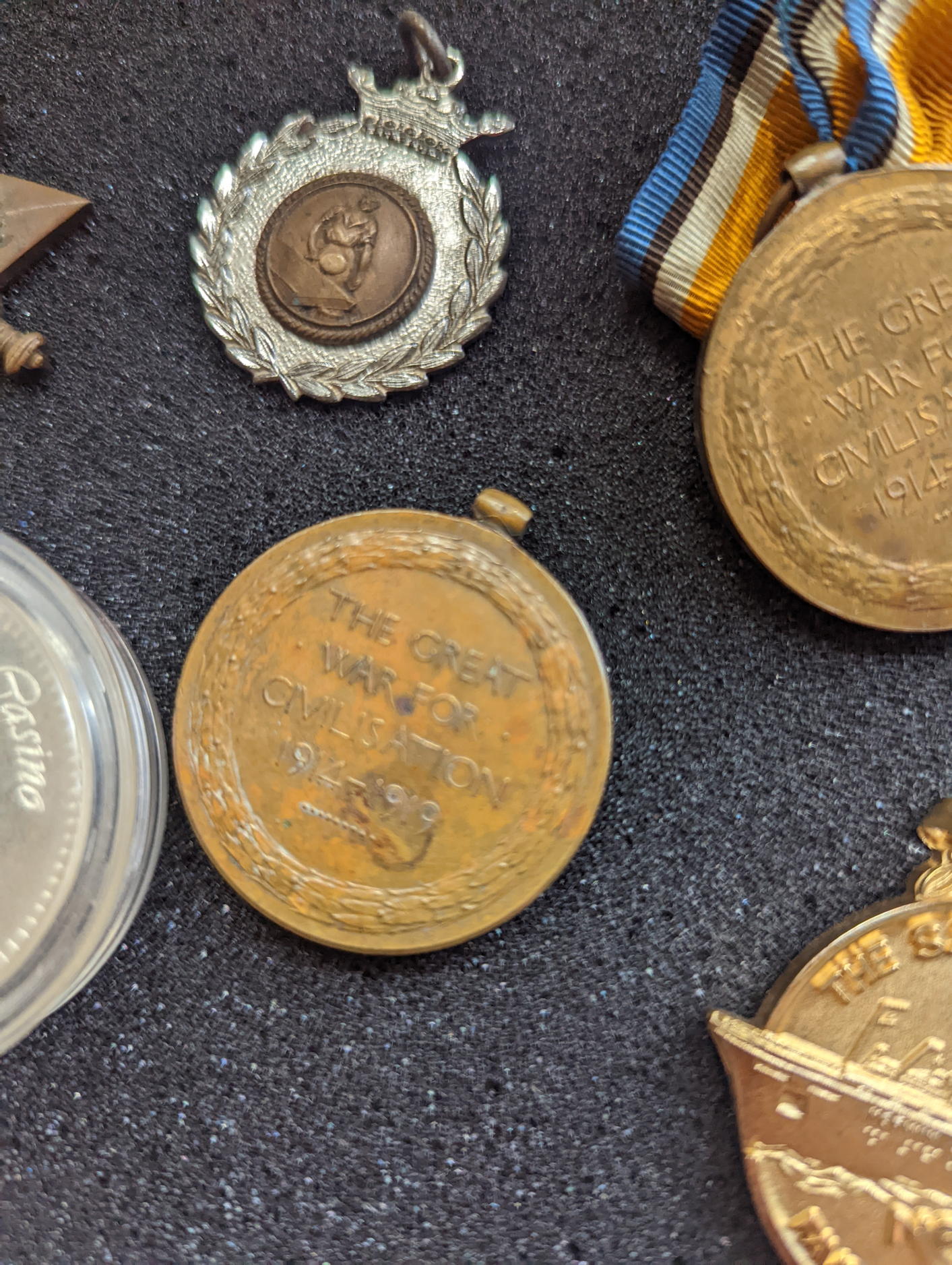 A collection of WWII military and other medals, coins to include a silver Moroccan dirham and casino - Image 4 of 4