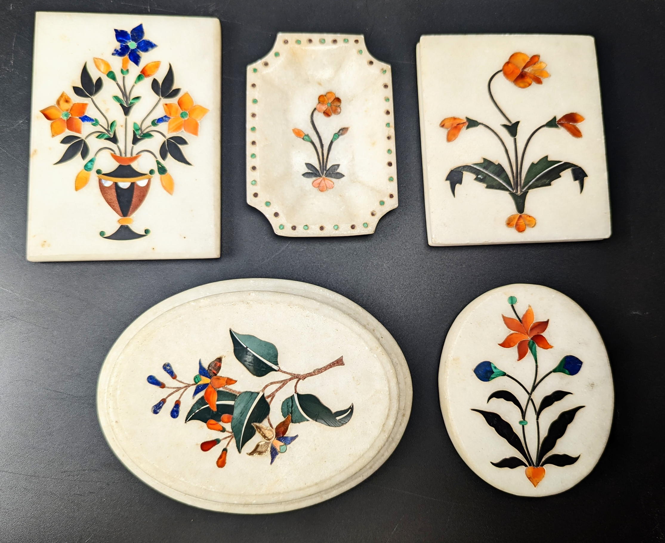 A collection of five 19th / early 20th century Indian Agra pietra dura inlaid marble paper weights