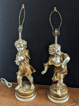 A pair of plaster cherub lamps