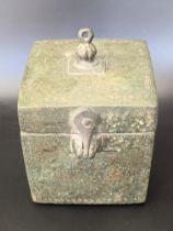 A rare 10-11th century Persian Ghaznavid cubic bronze box with small circle and dot designs, H.