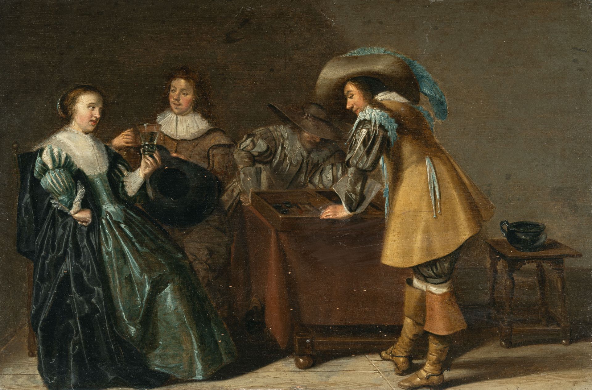 Dirck Hals (1591 – Haarlem – 1656) – Interior with trick track players and a couple drinking wine.