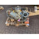 Pallet containing quantity of braided wire cable and pulleys