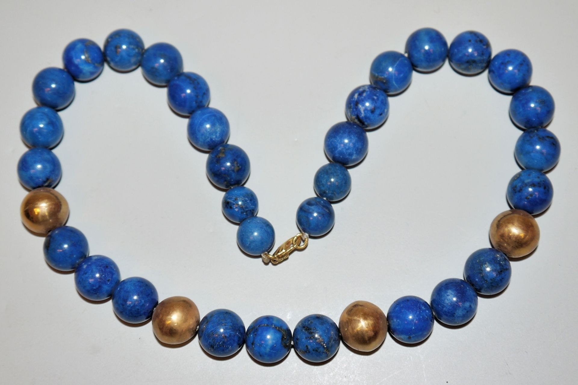 Designer lapis lazuli necklace with gold spheres