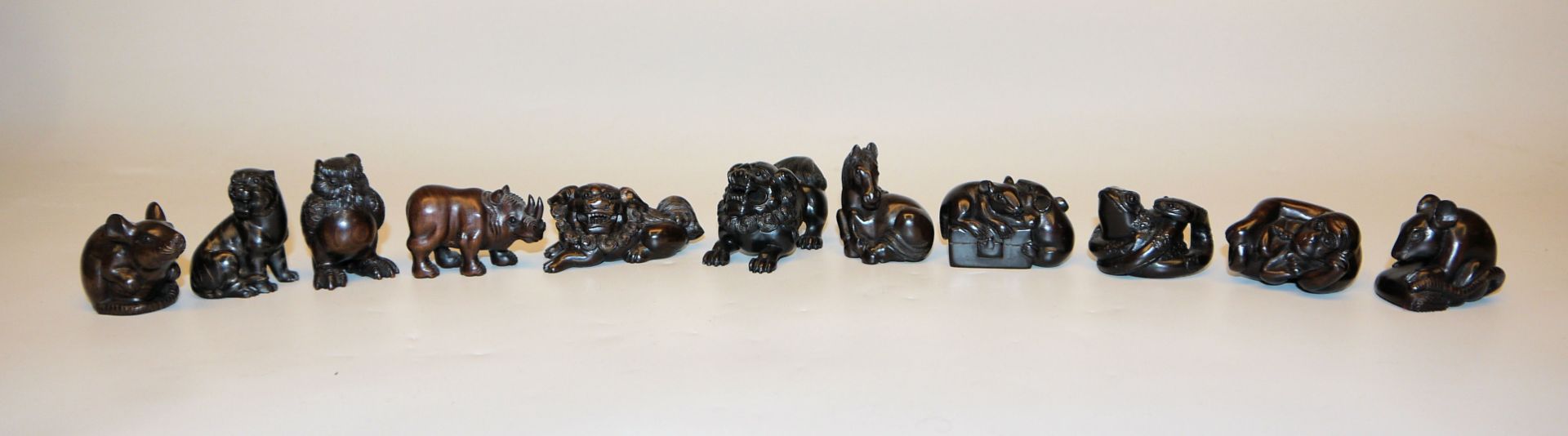 11 Japanese netsuke made of precious wood, animal figures of all kinds