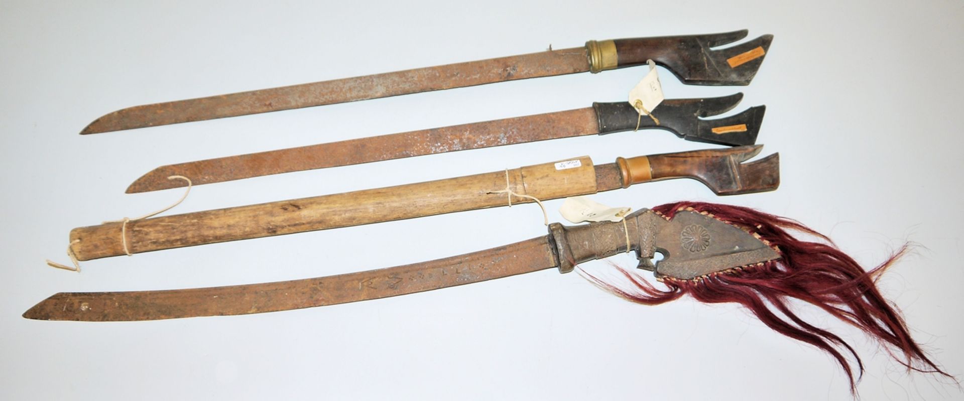 Four traditional Indonesian swords from Timor and Sulawesi 19th cent.