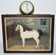 English ship's clock & showcase of a horse dealer, both around 1930