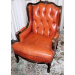 Comfortable leather armchair in Chesterfield style