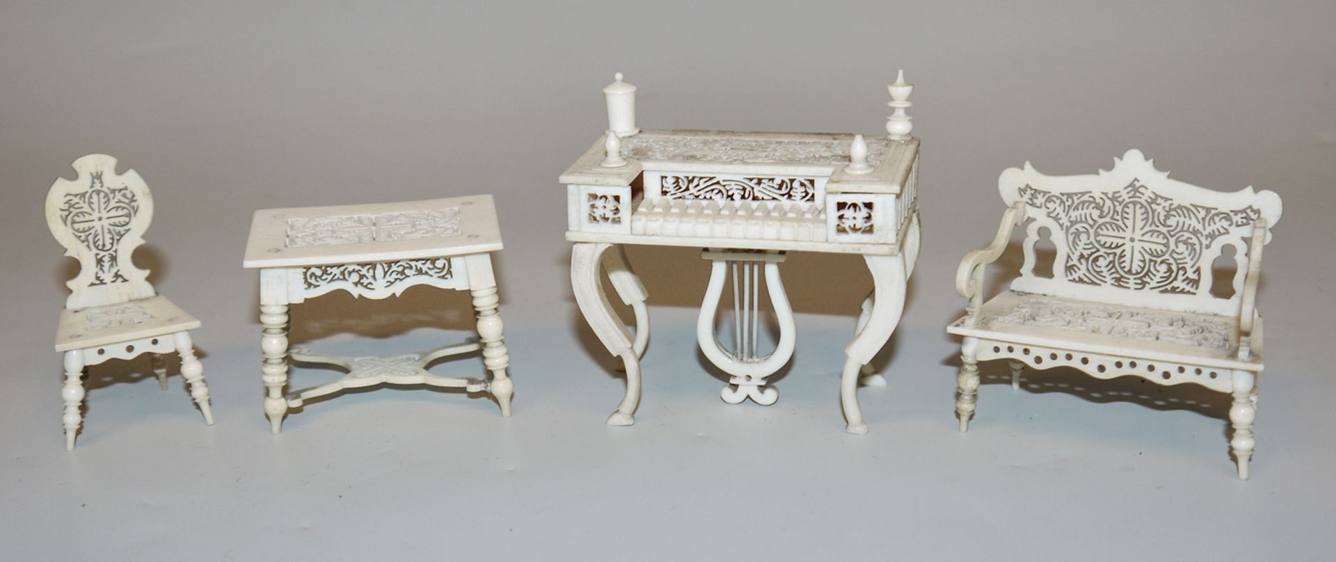 Four filigree pieces of Biedermeier doll's house furniture, 19th century