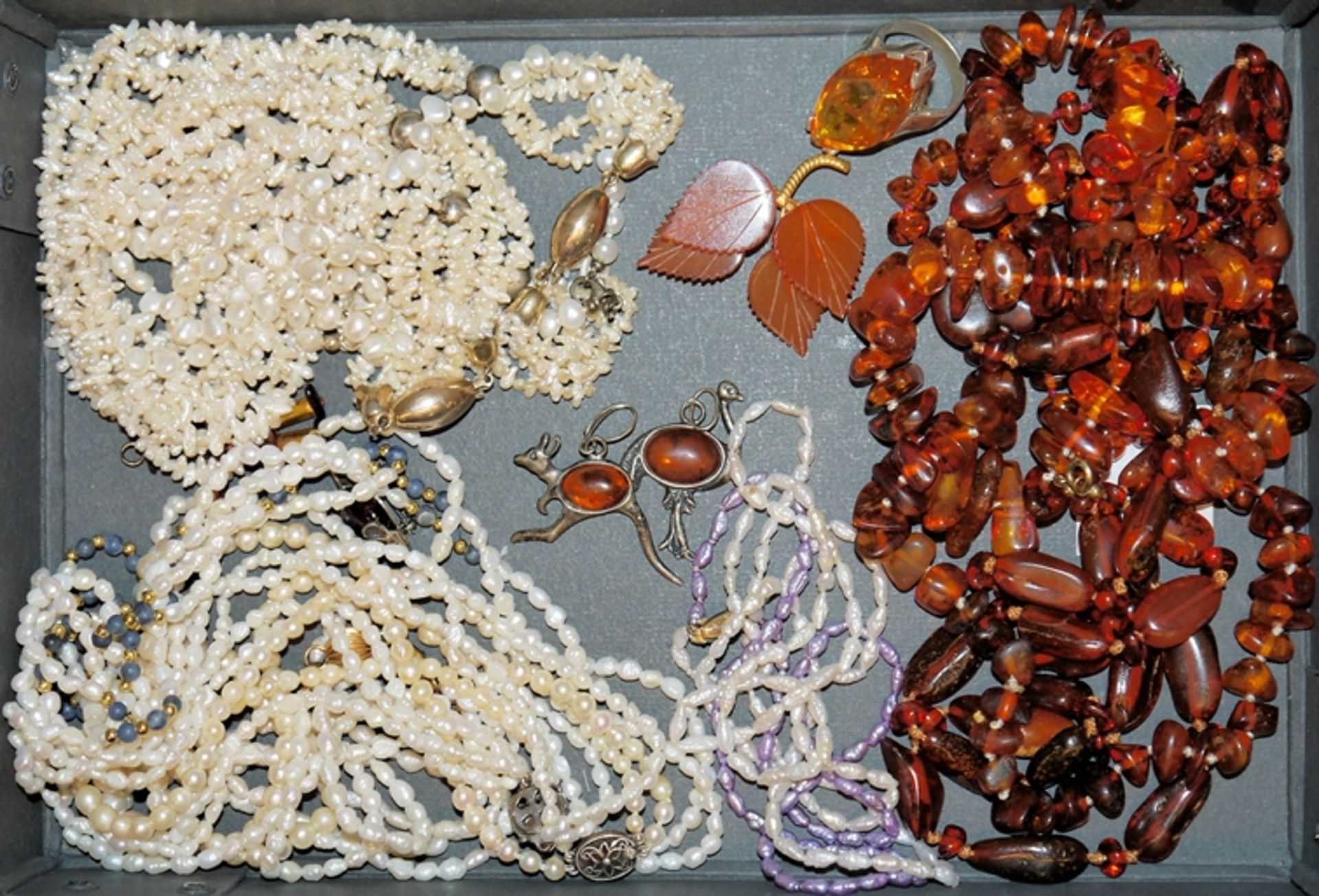 Collection of pearl necklaces and amber jewellery