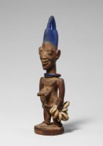 YORUBA TWIN FIGURE , ibeji, from the workshop of the “Master of Archaic Smile“