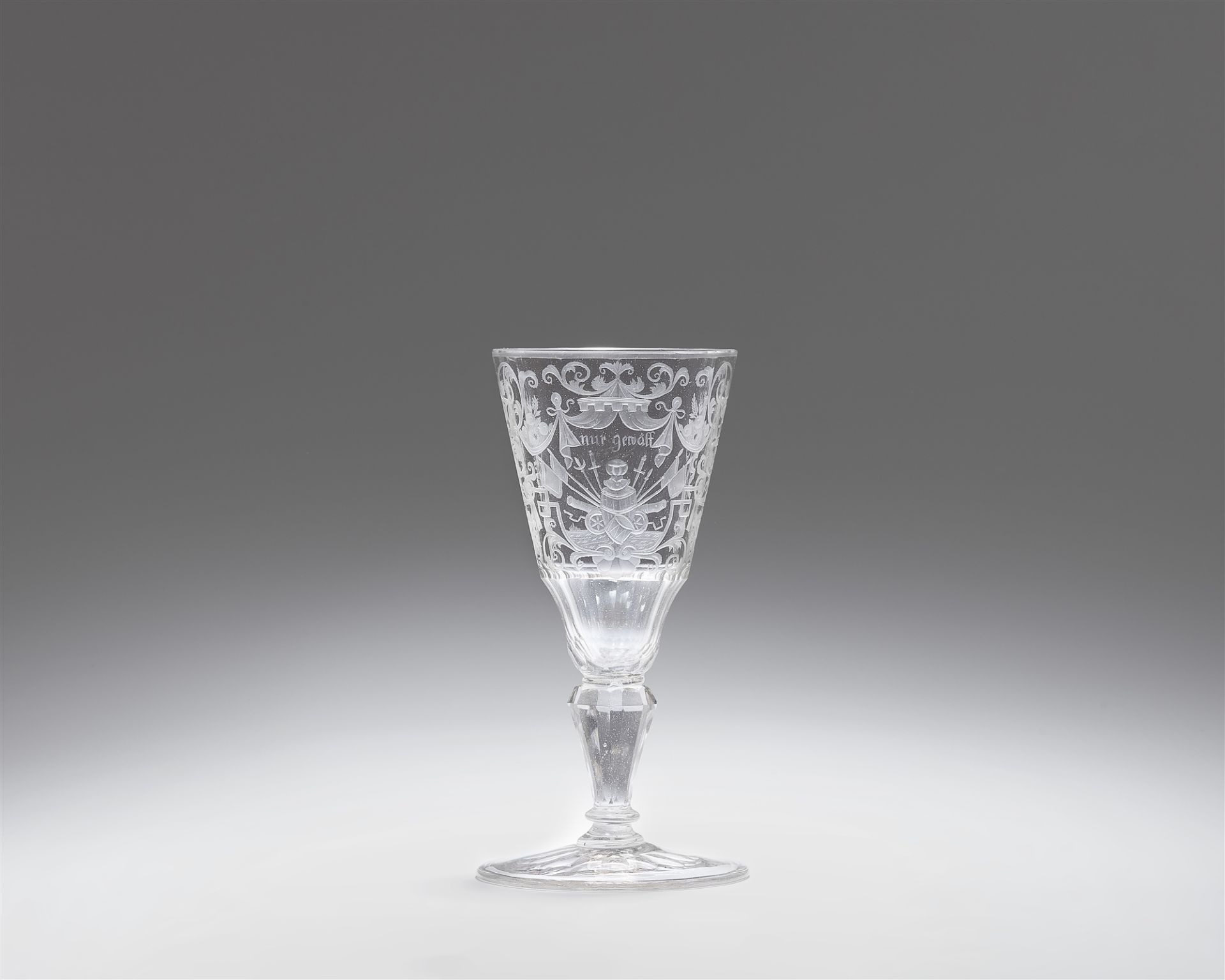 A cut glass goblet with trophies
