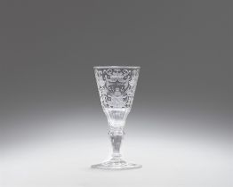 A cut glass goblet with trophies