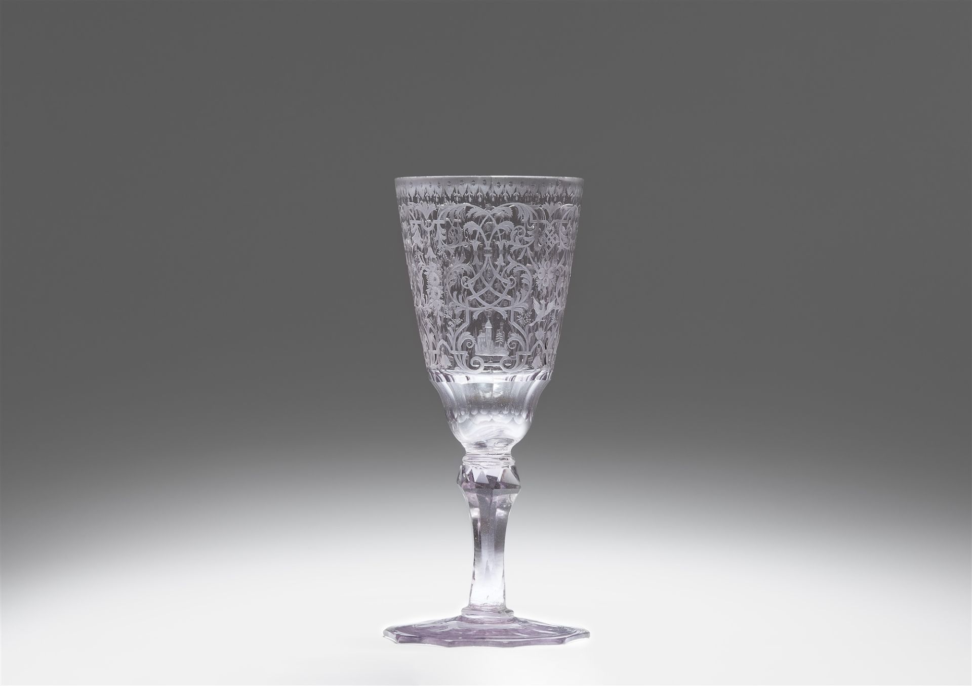 A cut glass goblet with strapwork decor