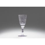 A cut glass goblet with strapwork decor