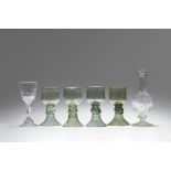 Four cut glass rummers, a goblet and a bottle