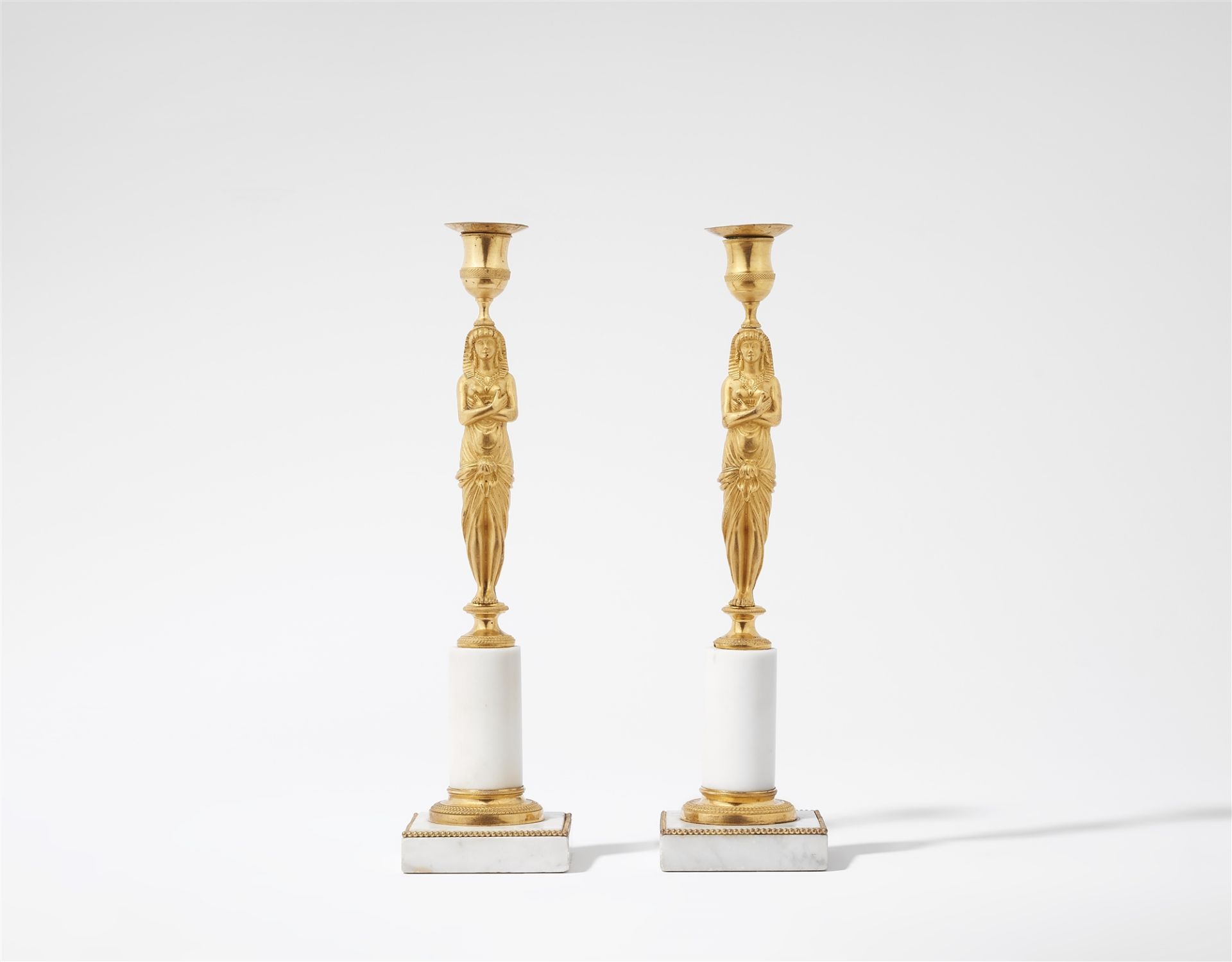 A pair of ormolu "retour d'égypte" candlesticks