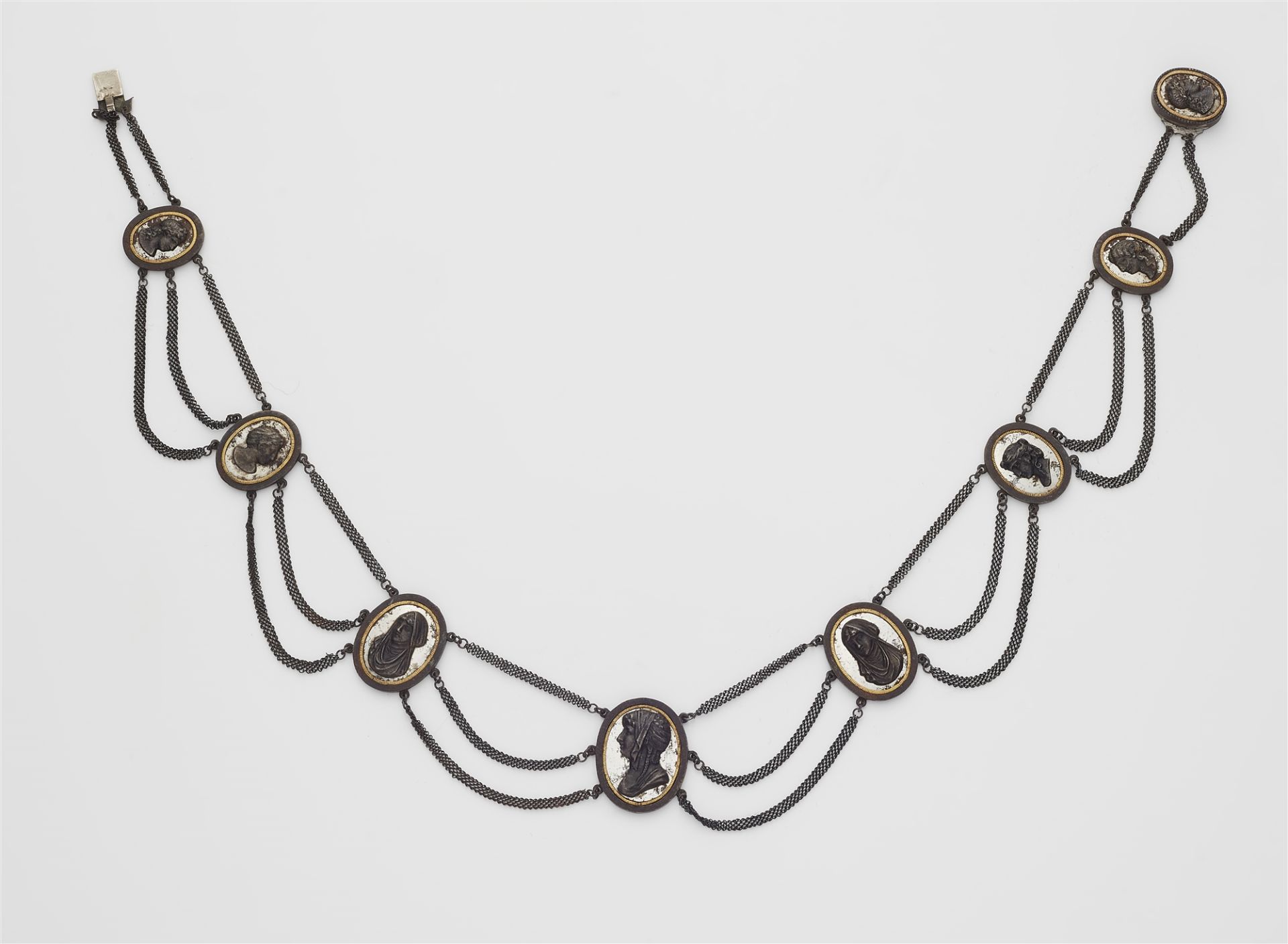A cast iron, steel and gold cameo necklace