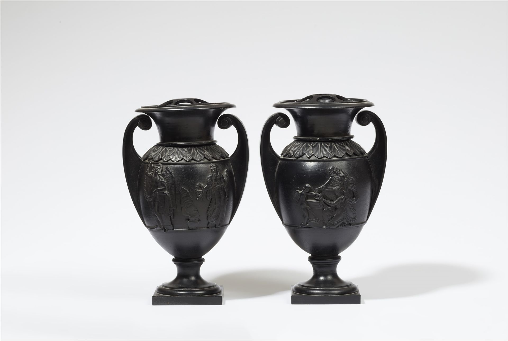 A pair of rare cast iron potpourri vases