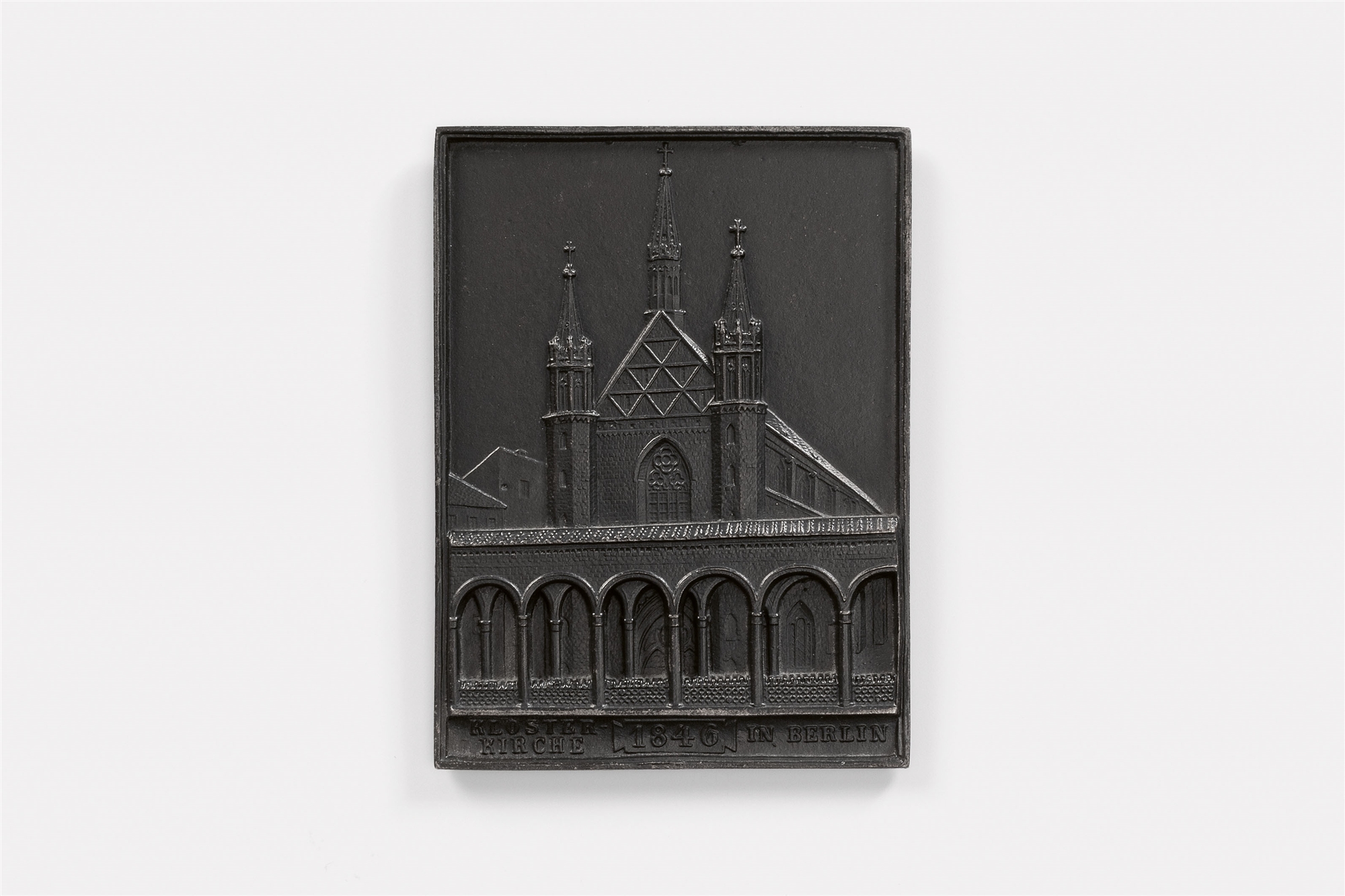 A cast iron New Year's plaque inscribed "KLOSTER-KIRCHE 1846 IN BERLIN"