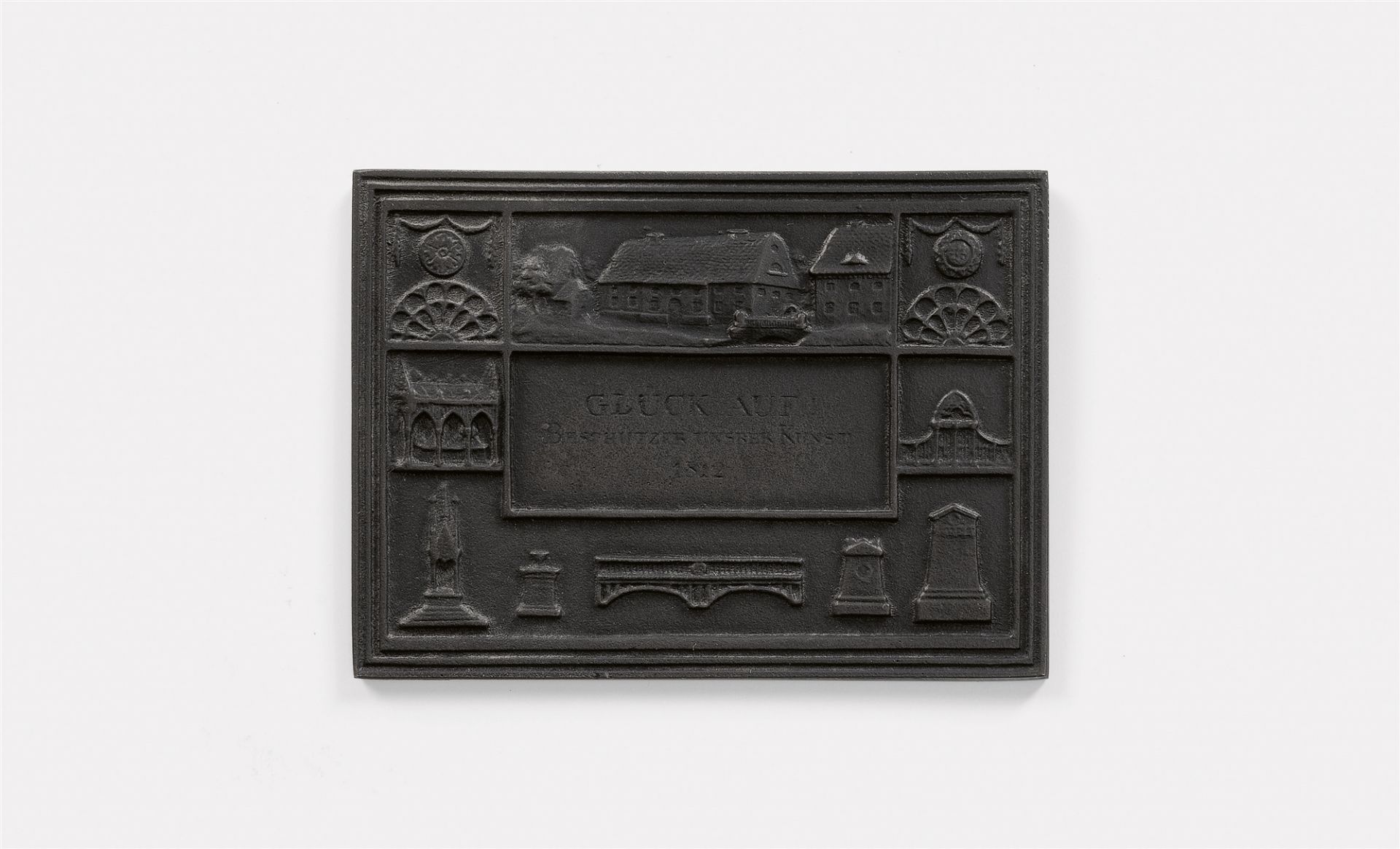 A cast iron New Year's plaque inscribed "GLÜCK AUF! BESCHÜTZER UNSERER KUNST 1812"