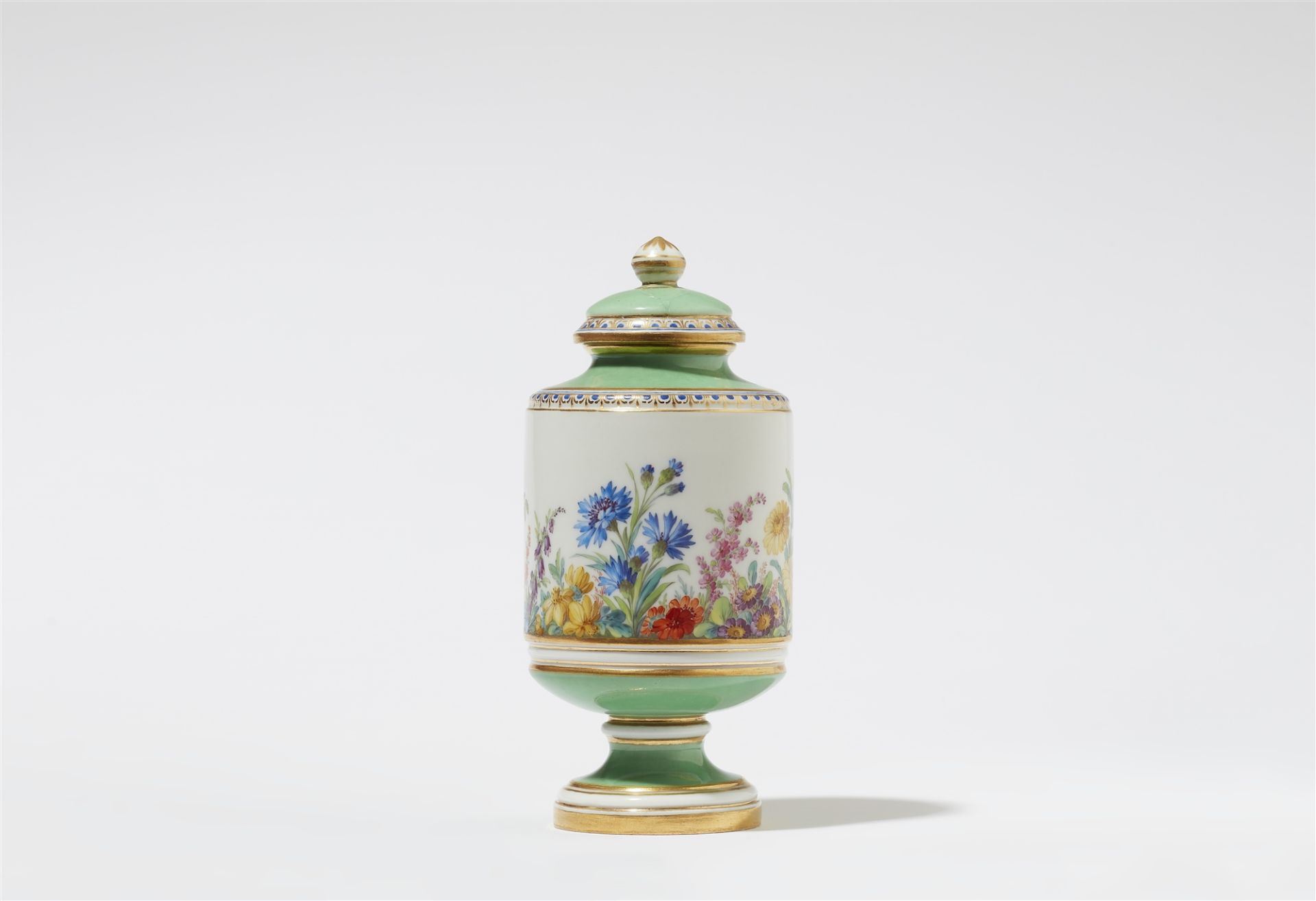 A rare Berlin KPM porcelain tea caddy with "fleurs en terrasse"