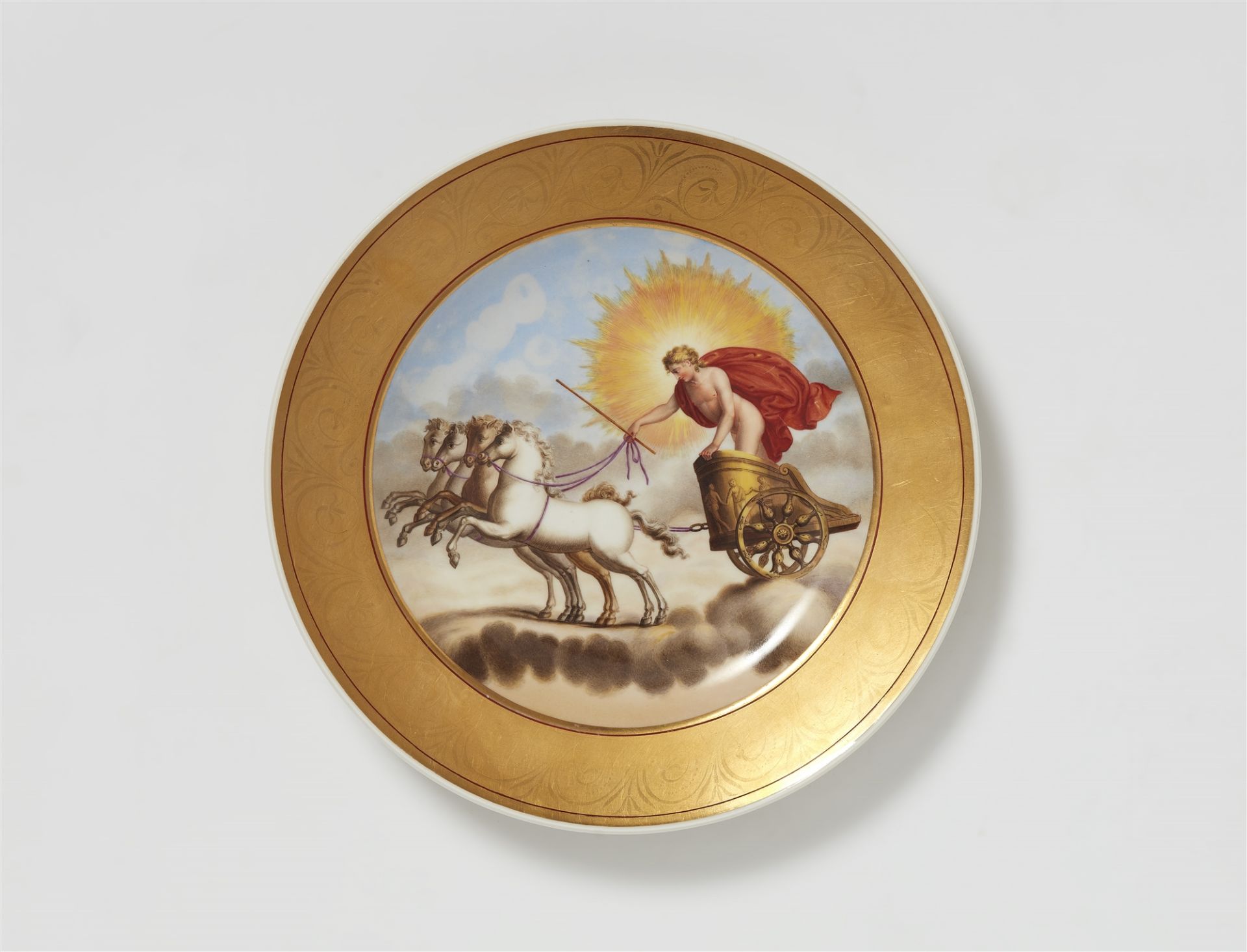 A Berlin KPM porcelain plate showing Helios in his chariot