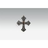 A cast iron and polished steel cross pendant