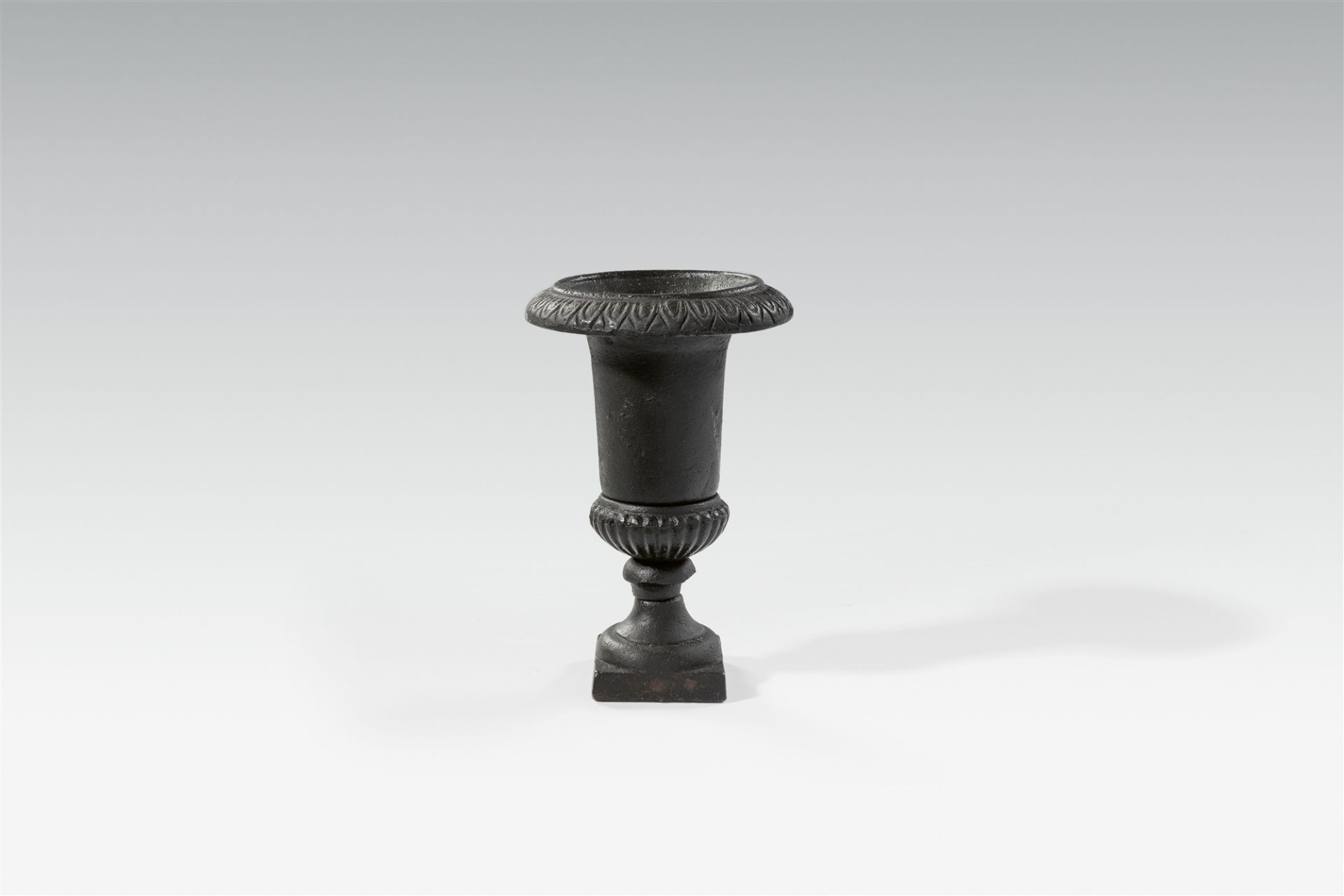 A small cast iron krater-form vase