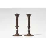 A pair of cast iron candelabra after a design by Karl Friedrich Schinkel