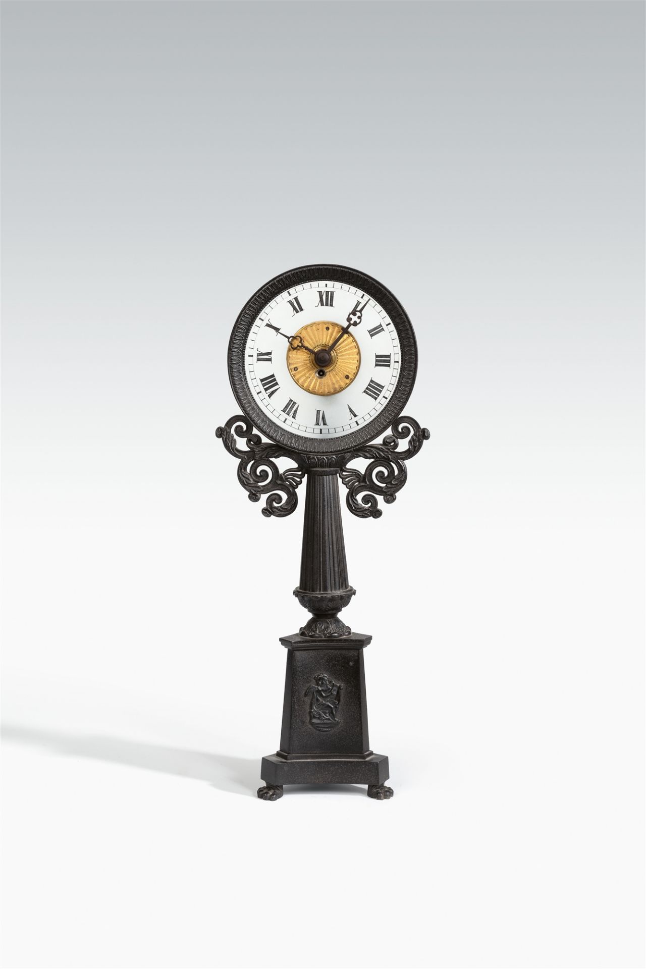 A cast iron night clock "Trespied"