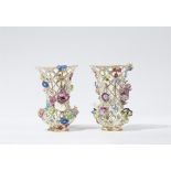 A pair of Meissen porcelain vases with floral appliques