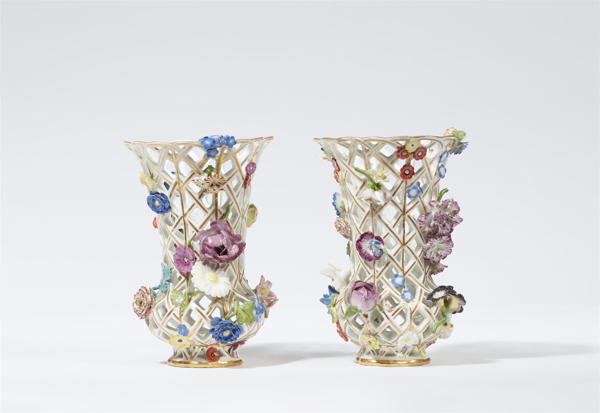 A pair of Meissen porcelain vases with floral appliques