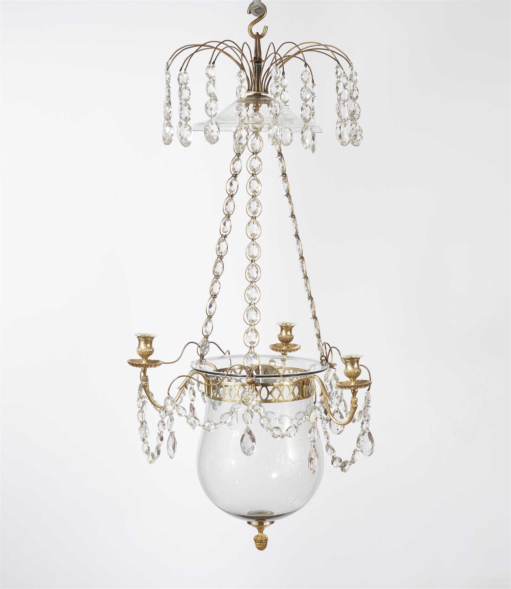 A brass three-flame chandelier