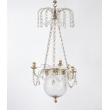 A brass three-flame chandelier